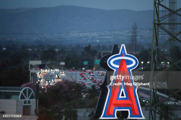 The Los Angeles Angels logo is seen against the freeway during the game against the Houston Astros at Angel Stadium of Anaheim on September 03, 2022...