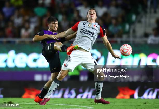 Jorge Meré of Mazatlán and Julio Furch of Atlas fight for the ball during the 13th round match between Mazatlan FC and Atlas as part of the Torneo...