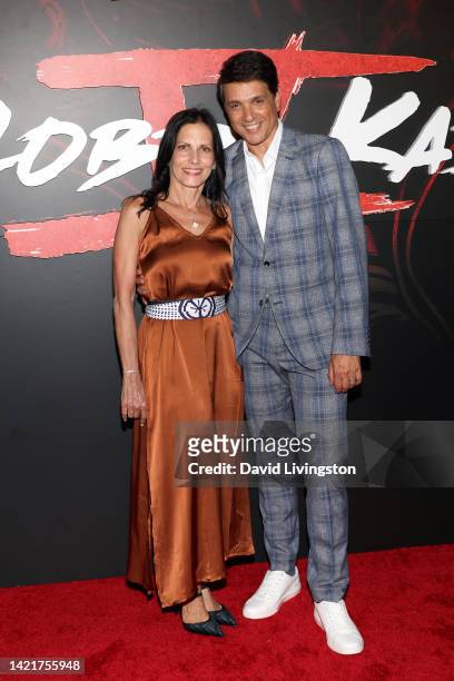 Phyllis Fierro and Ralph Macchio attend Netflix's "Cobra Kai" Season 5 Premiere Event at Los Angeles State Historic Park on September 07, 2022 in Los...