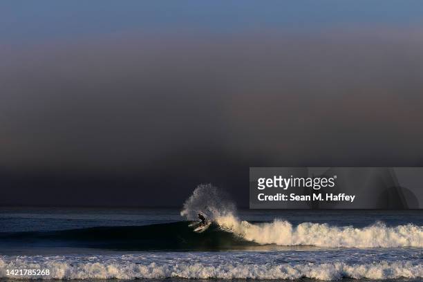 Surfer rides a wave at Lower Trestles ahead of the Ripcurl WSL Finalon September 07, 2022 in San Clemente, California.