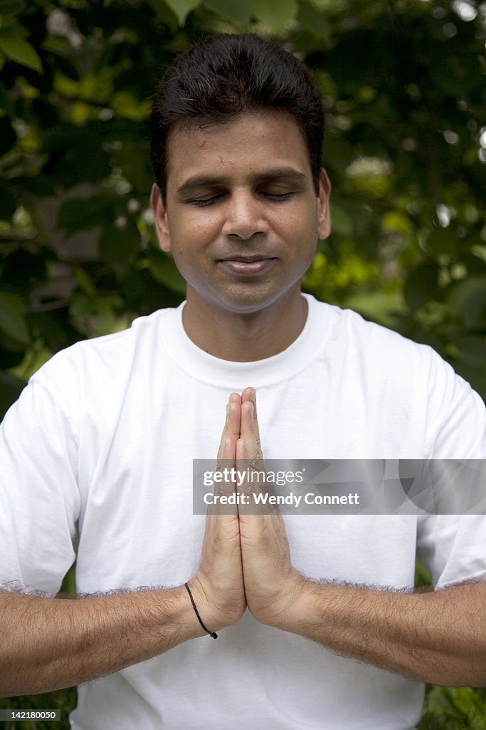 Indian man praying