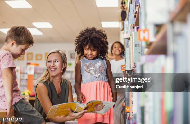 children visiting the library - kids reading in classroom stock pictures, royalty-free photos & images