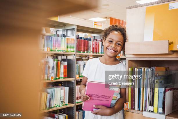 young kid visiting the library - literature student stock pictures, royalty-free photos & images