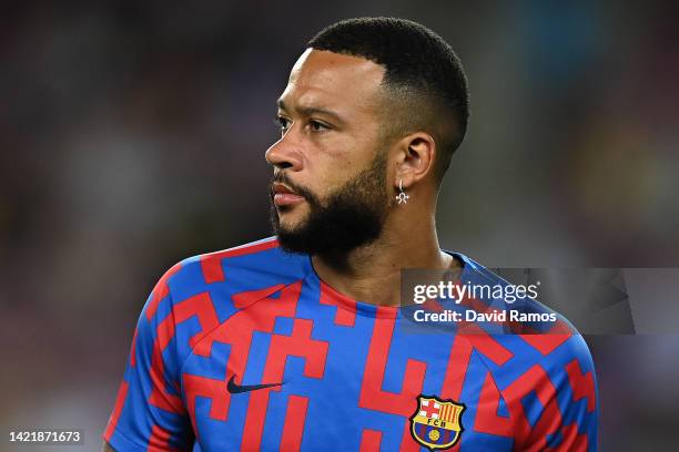 Memphis Depay of FC Barcelona looks on during the warm up prior to the UEFA Champions League group C match between FC Barcelona and Viktoria Plzen at...