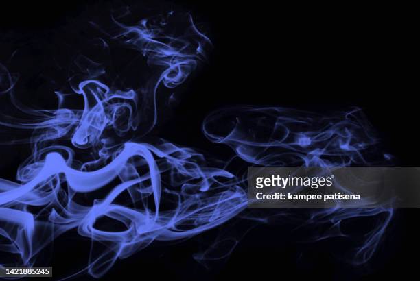 blue smoke against black background - fire transparent stock pictures, royalty-free photos & images