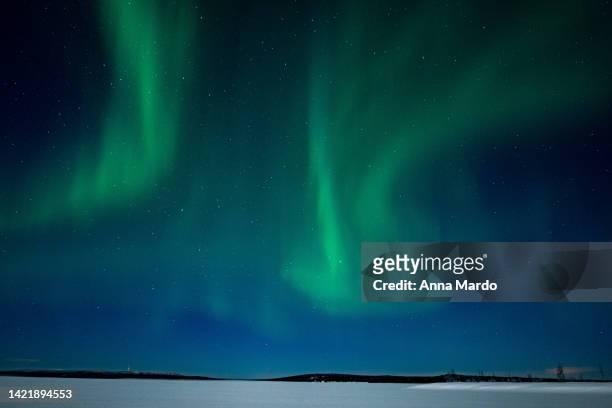 green northern lights dancing on the night sky around rovaniemi - inari finland bildbanksfoton och bilder