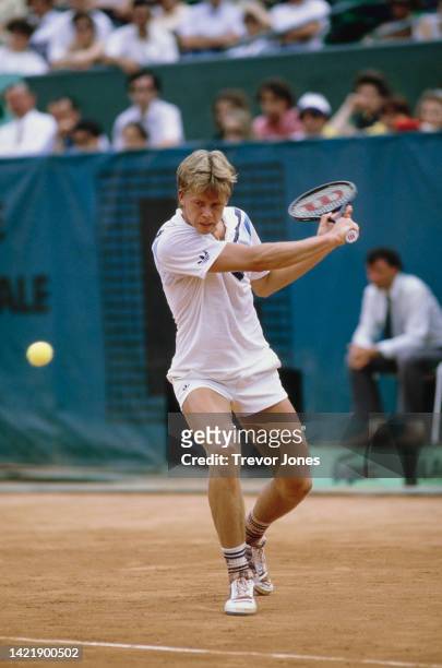 Stefan Edberg of Sweden makes a backhand return against Jimmy Connors of the United States during their Men's Singles Quarterfinal match at the...