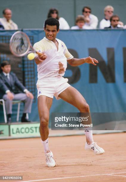 Yannick Noah of France plays a forehand return against Balázs Taróczy of Hungary during their Men's Singles Fourth Round match at the French Open...