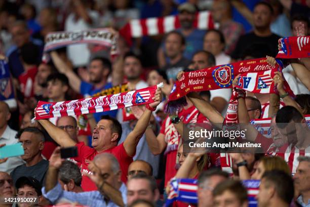 Fans of Atletico de Madrid cheer during the UEFA Champions League group B match between Atletico Madrid and FC Porto at Civitas Metropolitano Stadium...