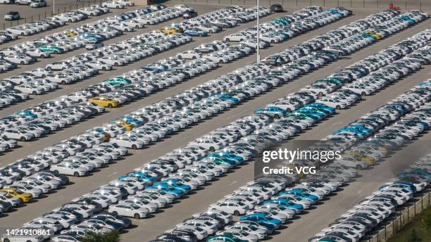Aerial view of new electric cars sitting parked at a parking lot of Geely's Jinzhong manufacturing facility on September 7, 2022 in Jinzhong, Shanxi...