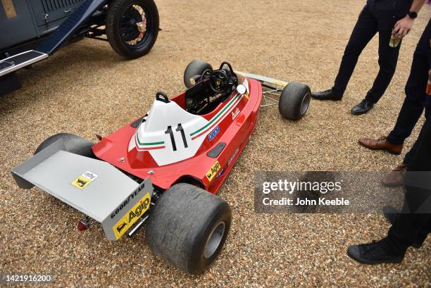 Visitors view a child's replica of Niki Lauda's Ferrari 312T formula one car built in the 1970s during the Concours of d'elegance at Hampton Court...