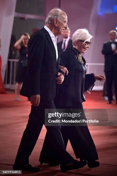 Italian fahion designer Anna Fendi and her parnter Giuseppe Tedesco at the 79 Venice International Film Festival 2022. Dead For A Dollar red carpet....