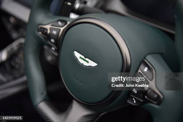 The steering wheel with logo of a Aston Martin V12 Speedster supercar is displayed during the Concours of d'elegance at Hampton Court Palace on...