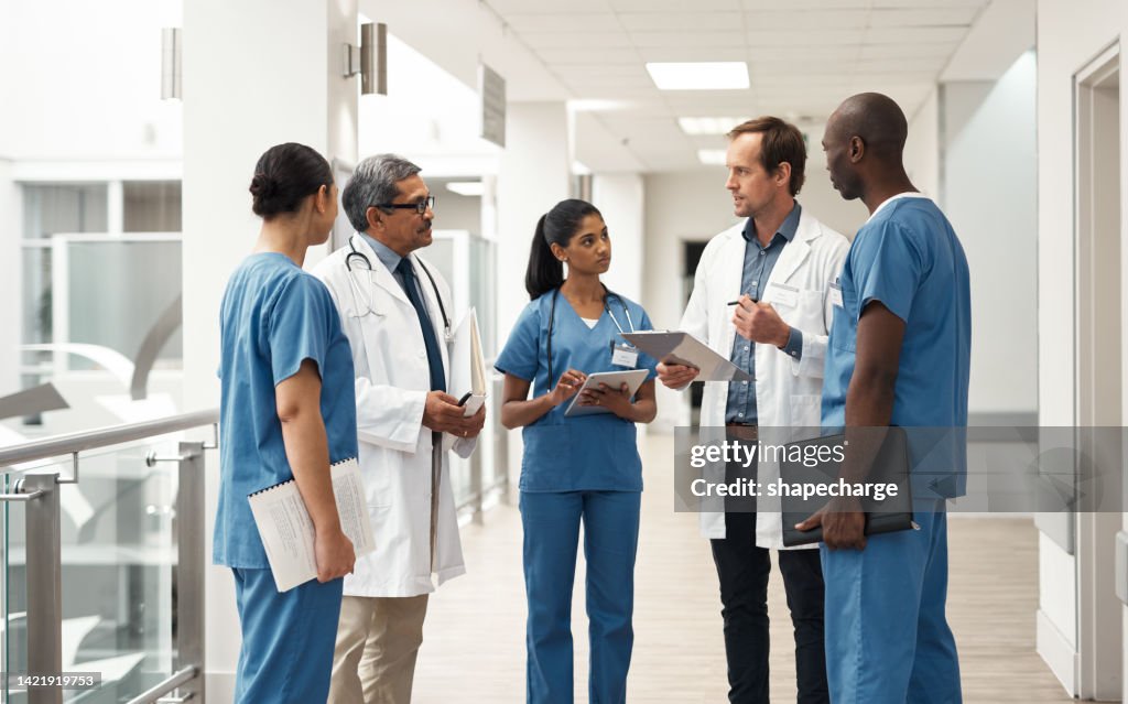 Doctor, nurse and medical meeting with tablet, paper and lab data for medicine innovation idea and research in hospital. Teamwork, healthcare leadership and collaboration communication in help clinic