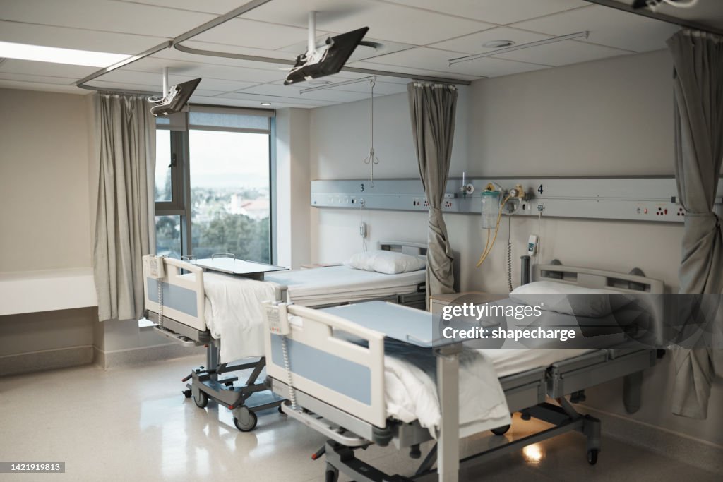 Healthcare, insurance and medical hospital bed interior or ward room for insurance, health care or clinic background. Covid 19, disease and specialized treatment center for ill, sick or recovery