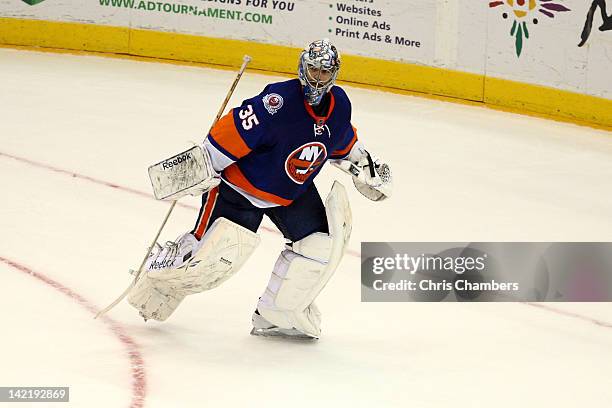 Goalie Al Montoya of the New York Islanders skates towards the net against the Pittsburgh Penguins at Nassau Veterans Memorial Coliseum on March 29,...