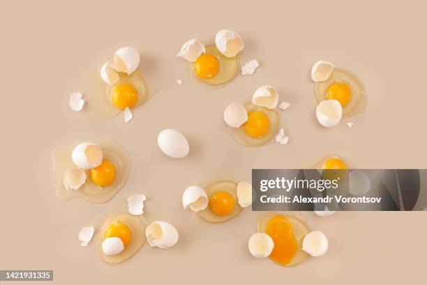 broken eggs - egg yolk stock pictures, royalty-free photos & images