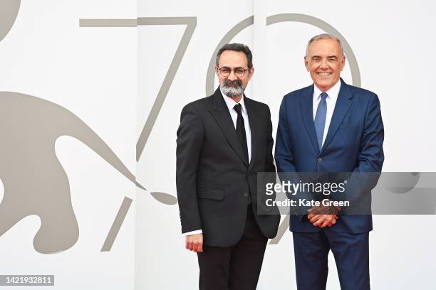 Director Vahid Jalilvand and Director of the Venice Film Festival Alberto Barbera attend the "Shab, Dakheli, Divar" red carpet at the 79th Venice...