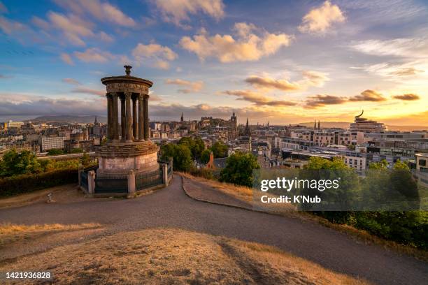 view point of dugald stewart monument on calton hill near royal mile and view of historical caltle in edinburgh city of scotland, north of united kingdom, uk in summer at sunset time - edinburgh fotografías e imágenes de stock