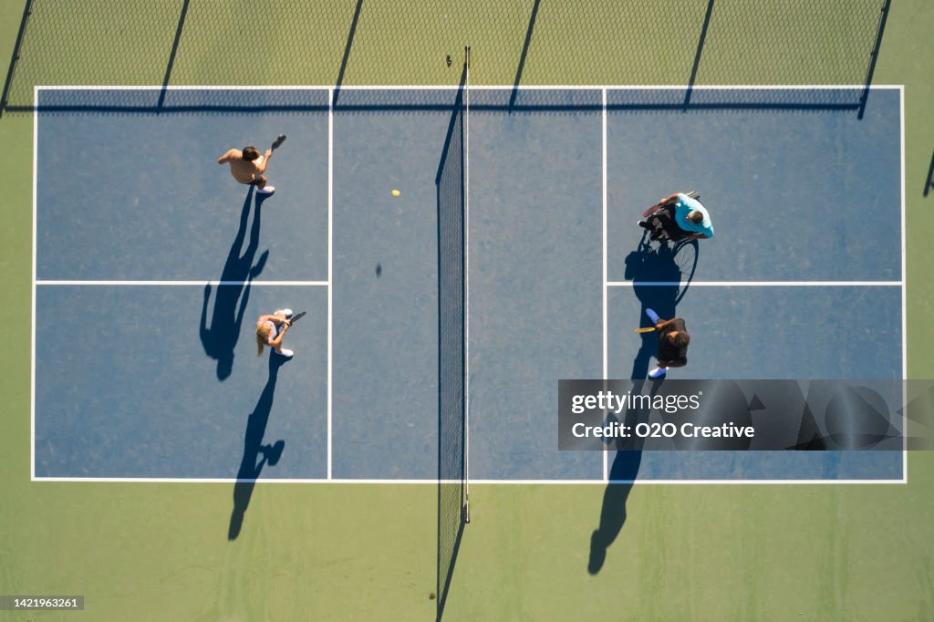 Young Adults Playing Pickleball on a Public Court