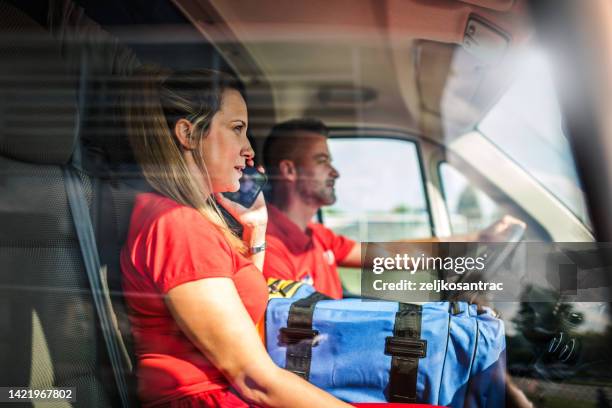 man driving ambulance paramedic transportation - paramedic stock pictures, royalty-free photos & images