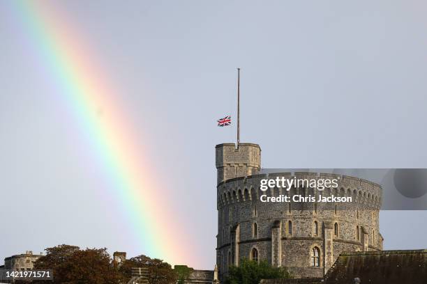 The Union flag is lowered on Windsor Castle as a rainbow covers the sky on September 08, 2022 in Windsor, England. Elizabeth Alexandra Mary Windsor...