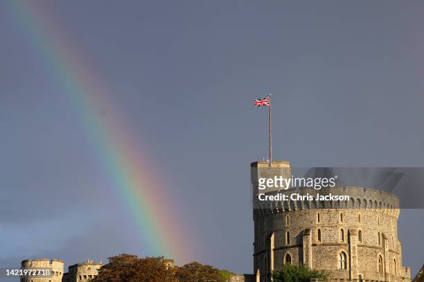 The Union flag is lowered on Windsor Castle as a rainbow covers the sky on September 08, 2022 in Windsor, England. Elizabeth Alexandra Mary Windsor...