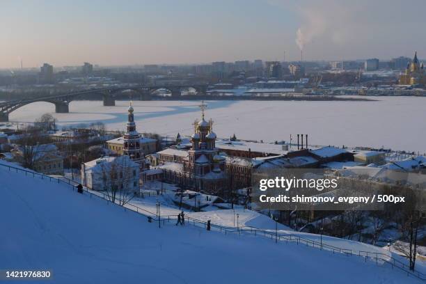 high angle view of buildings in city during winter,nizhny novgorod,nizhny novgorod oblast,russia - nischni nowgorod stock-fotos und bilder