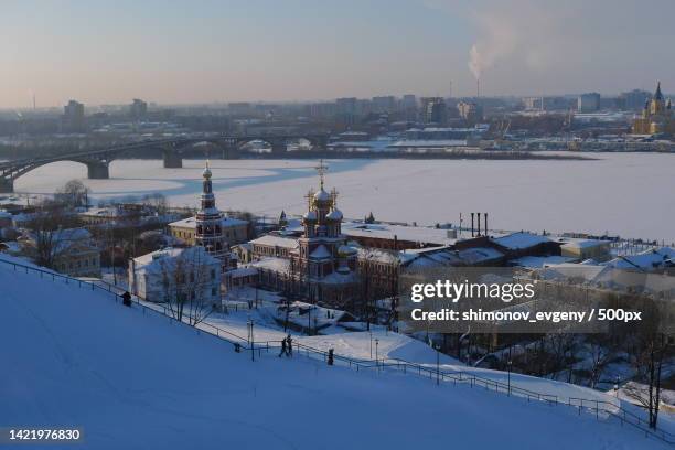 high angle view of buildings in city during winter,nizhny novgorod,nizhny novgorod oblast,russia - nizhny novgorod stockfoto's en -beelden