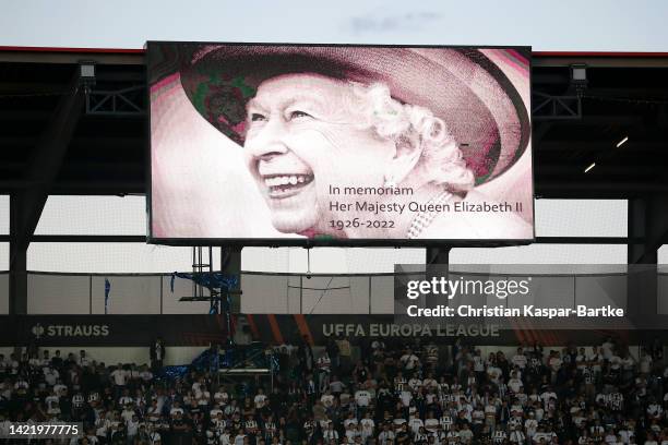 The LED board shows a photo Queen Elizabeth II as players of FC Zurich and Arsenal observe a minutes silence after it was announced that Queen...