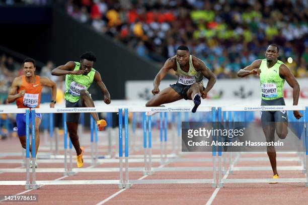 Grant Holloway of United States jumps the last hurdle before Rasheed Broadbell of Jamaica and Hansle Parchment of Jamaica to win Men's 110 Metres...
