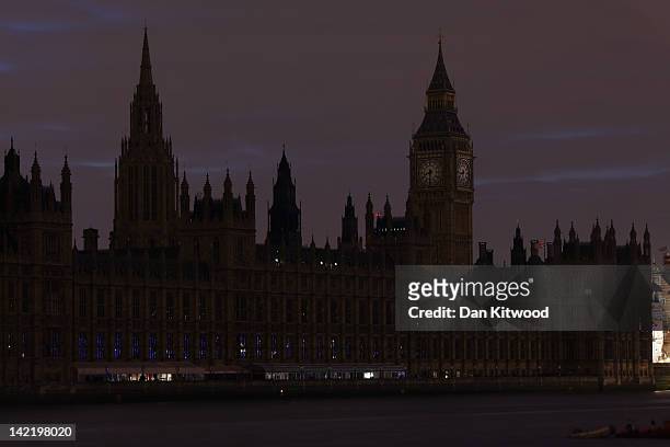 The lights are turned off on The Houses of Parliament in central London, to mark 'Earth Hour' on March 31, 2012 in London, England. According to...