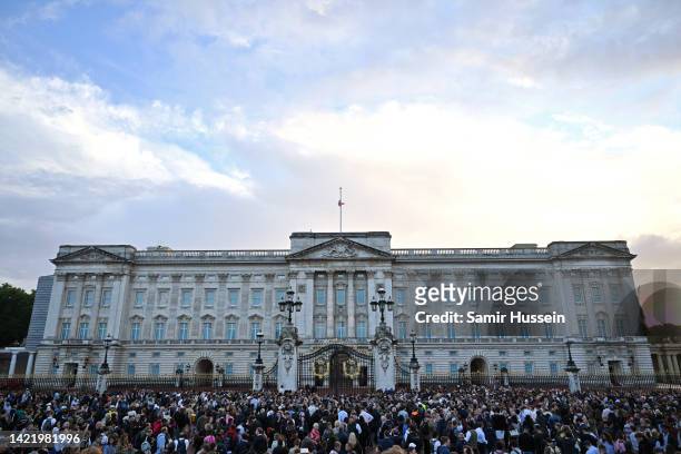 The Union flag flies half mast as people gather at Buckingham Palace on September 08, 2022 in London, England. Elizabeth Alexandra Mary Windsor was...