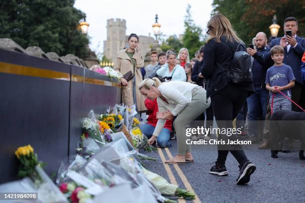 Members of the public leave flowers outside Windsor Castle on September 08, 2022 in Windsor, England. Elizabeth Alexandra Mary Windsor was born in...