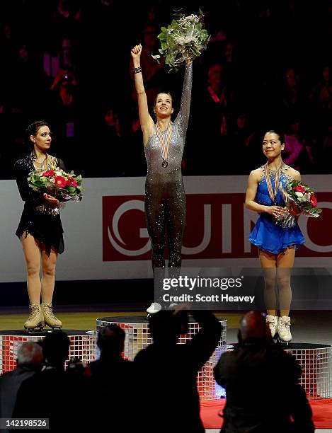 Alena Leonova of Russia , Akiko Suzuki of Japan and Carolina Kostner of Italy receive their medals during day six of the ISU World Figure Skating...