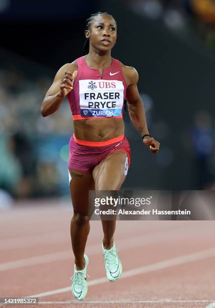 Shelly-Ann Fraser-Pryce of Jamaica crosses the finish line to win Women's 100 Metres before Marie-Josee Ta Lou of Ivory Coast and Shericka Jackson of...