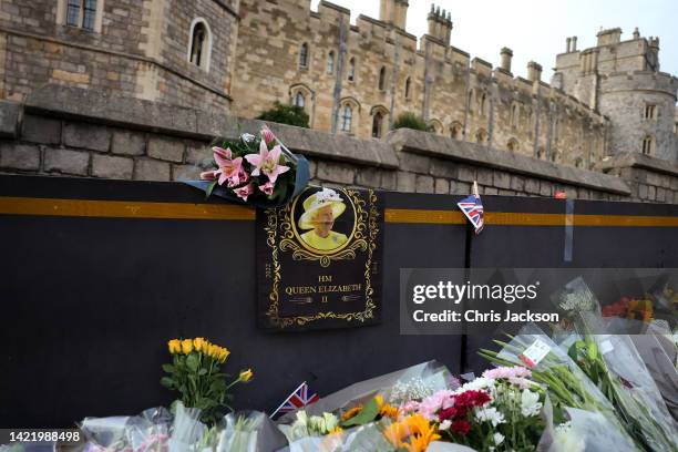 Tributes are laid outside of Windsor Castle on September 08, 2022 in Windsor, England. Elizabeth Alexandra Mary Windsor was born in Bruton Street,...