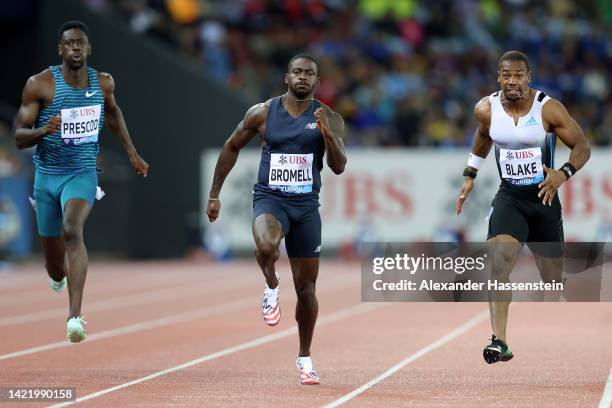 Trayvon Bromell of United States approaches the finish line before Reece Prescod of Great Britain and Yohan Blake of Jamaica to win Men's 100 Metres...