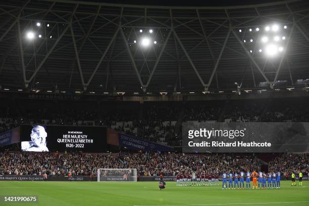 Players of West Ham United and FCSB observe a minutes silence after it was announced that Queen Elizabeth II has passed away today during the UEFA...