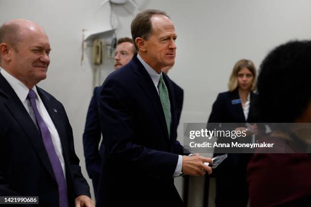 Sen. Chris Coons and Sen. Pat Toomey walk through the Senate Subway during a vote in the U.S. Capitol on September 08, 2022 in Washington, DC....