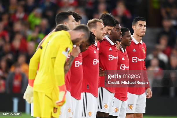 Cristiano Ronaldo of Manchester United observe a minutes silence with teammates after it was announced that Queen Elizabeth II has passed away today...