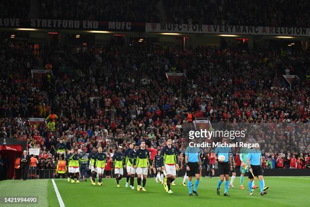 Harry Maguire of Manchester United leads their side out onto the pitch prior to the UEFA Europa League group E match between Manchester United and...