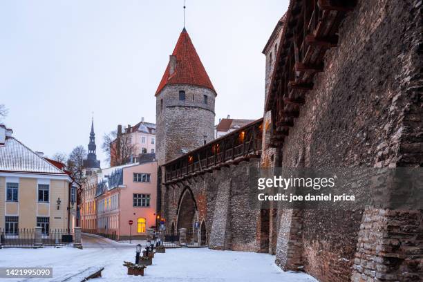 tower and surrounding walls, winter, tallinn, estonia - tallinn stock pictures, royalty-free photos & images