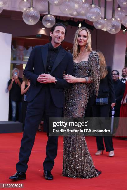 Adrien Brody and British stylist Georgina Chapman attend the "Blonde" red carpet at the 79th Venice International Film Festival on September 08, 2022...