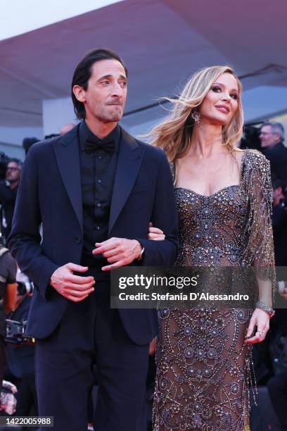 Adrien Brody and British stylist Georgina Chapman attend the "Blonde" red carpet at the 79th Venice International Film Festival on September 08, 2022...