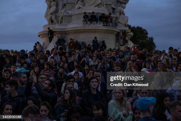 Crowds gather on the Queen Victoria Memorial in front of Buckingham Palace following the death today of Queen Elizabeth II in Balmoral, on September...