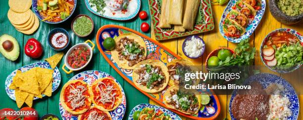 mexican festive food for independence day independencia - chiles en nogada, tacos al pastor, chalupas pozole, tamales, chicken with mole poblano sauce. colorful background, top view - mexico vs chile fotografías e imágenes de stock