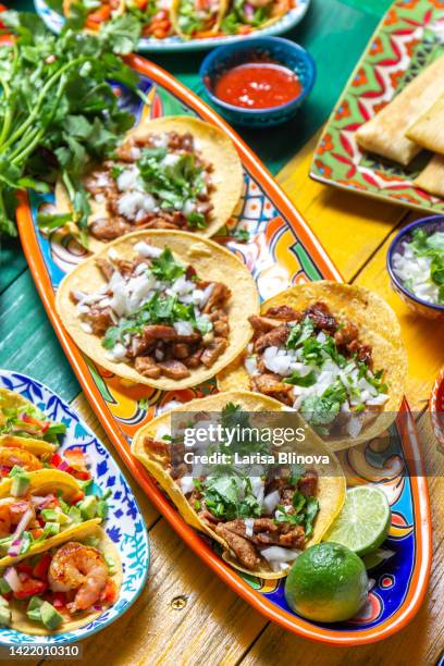 mexican festive food for independence day independencia - tacos al pastor, chalupas pozole, tamales. colorful background, top view - mexican food foto e immagini stock