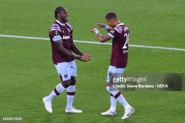 Michail Antonio of West Ham United celebrates with teammate Thilo Kehrer after scoring their team's third goal during the UEFA Europa Conference...