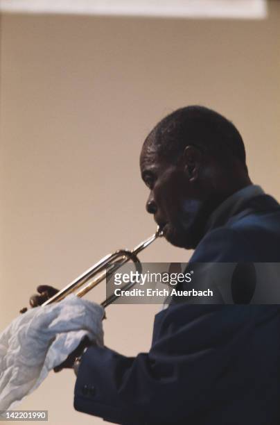 American jazz trumpeter and singer Louis Armstrong performing, circa 1956.